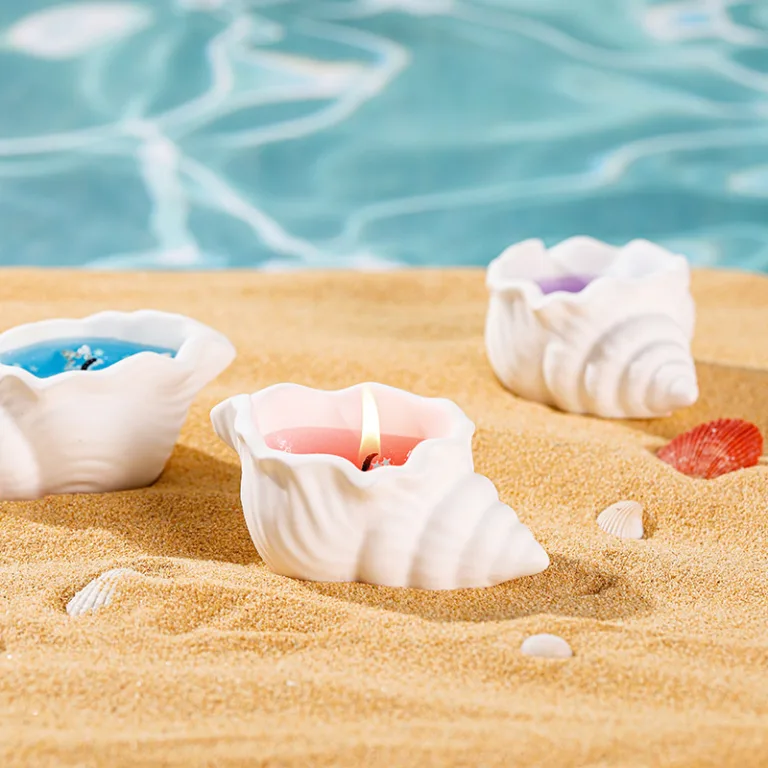 conch-shaped gel candle in gypsum container with ocean-inspired design