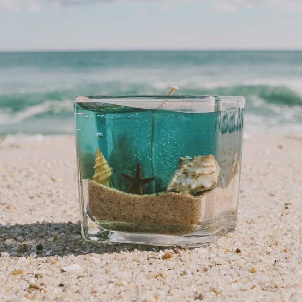 ocean-themed gel candle with starfish and shells