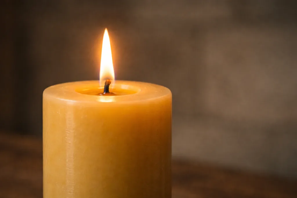 7 Reasons Churches Choose Beeswax Pillar Candles for Ceremonies 2 Close-up of a clean burning beeswax pillar candle with a steady flame and no smoke