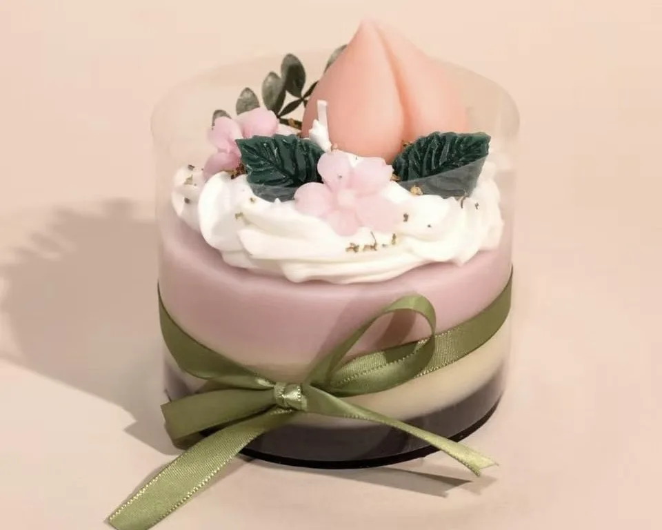 Best Budget Candle Brand Start: Dessert Handmade Candles 6 Layered dessert candle with peach shape topper, floral decoration and pastel color wax layers